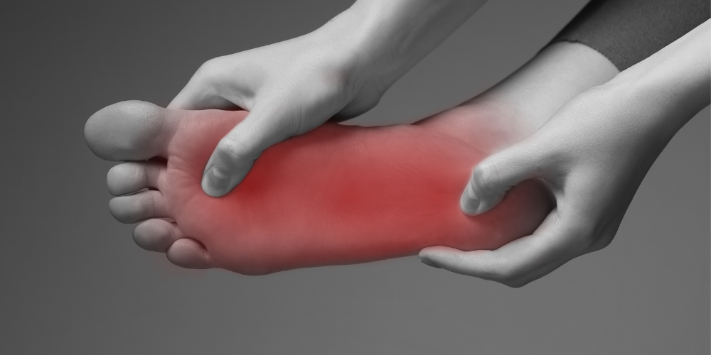 A person with foot pain due to walking and standing all day