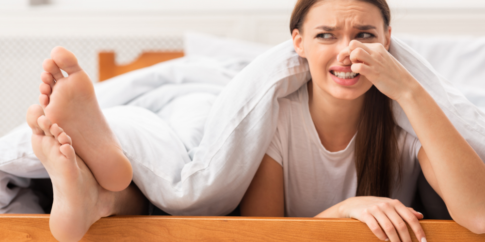 a person experiencing smelly feet