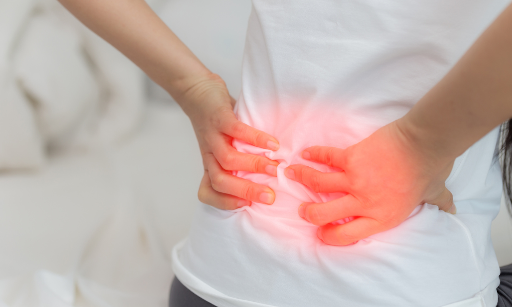 a man's back in red showing how orthotics can help with back pain