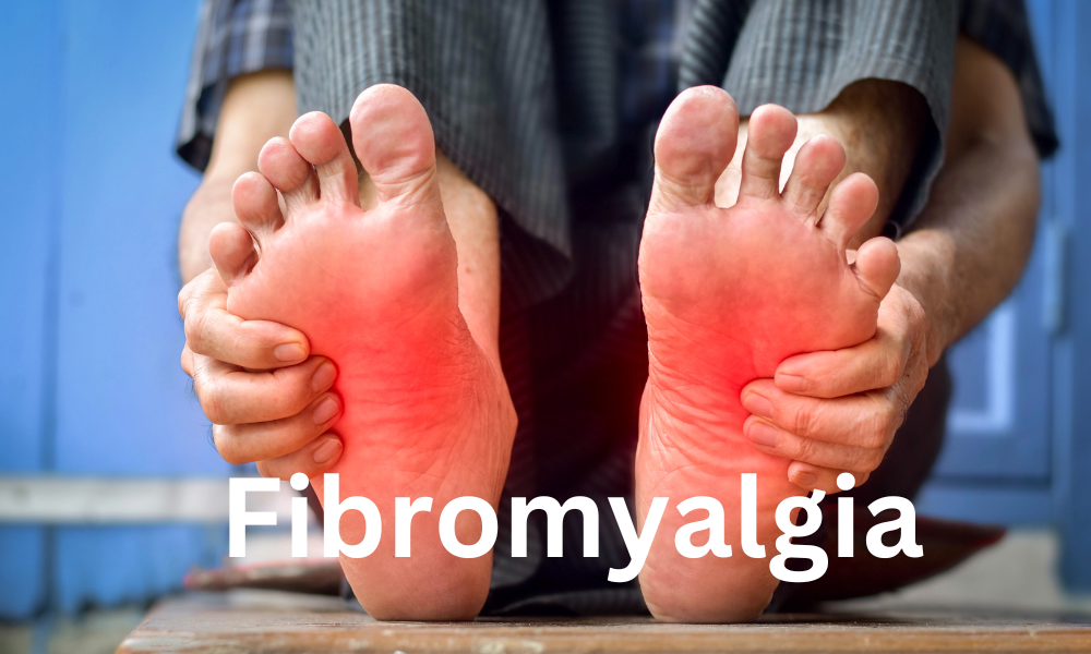 A man holding his feet in pain to answer the question How and Why does Fibromyalgia Cause Foot Pain?